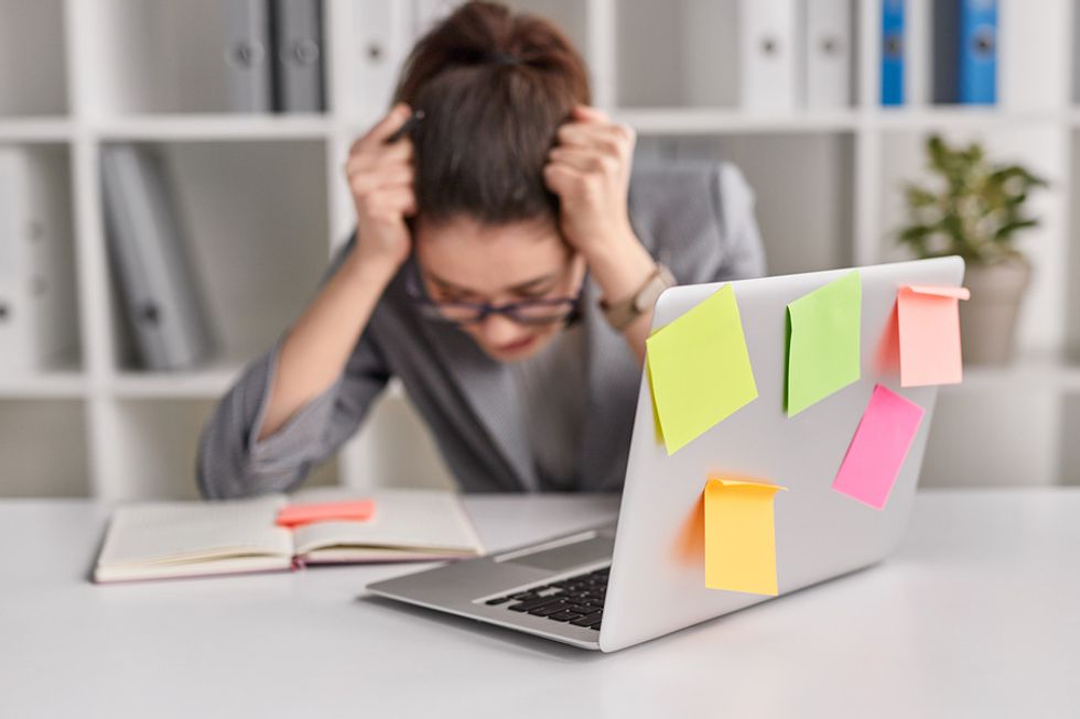 Woman feeling the effects of being overworked