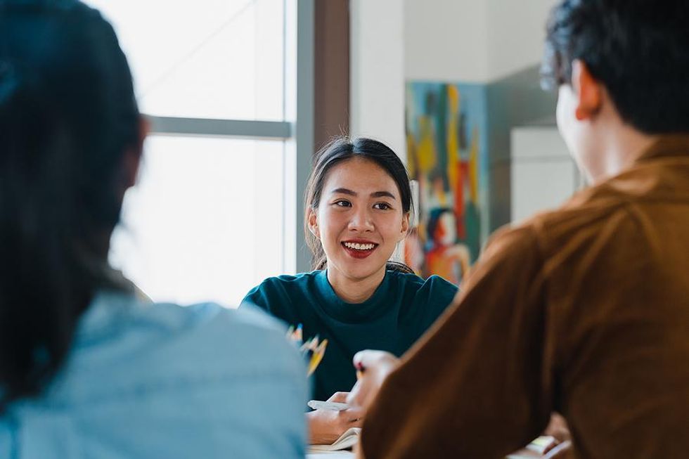 Woman gets career feedback from her colleagues at work