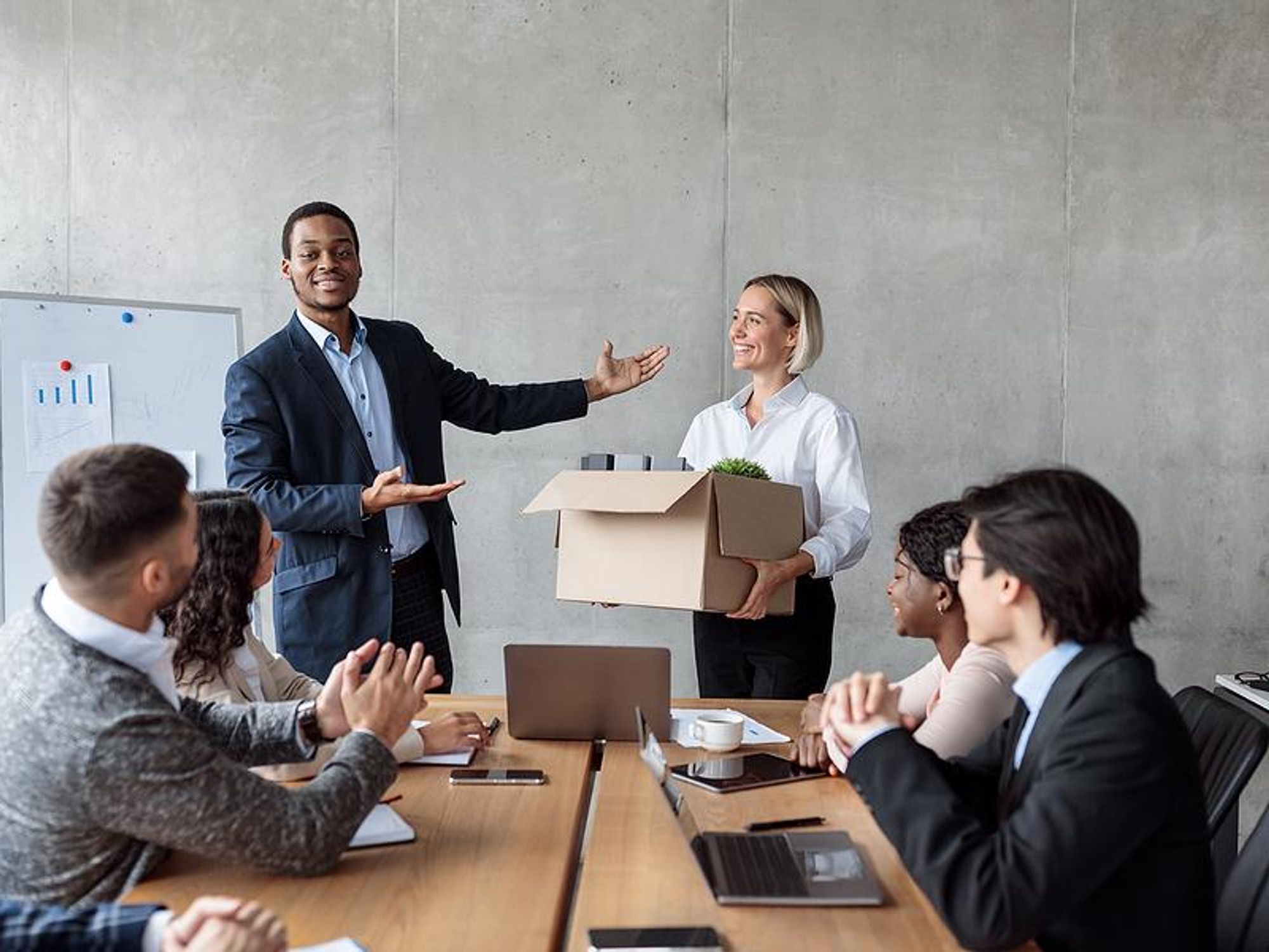 Woman gets introduced by her boss at her new job