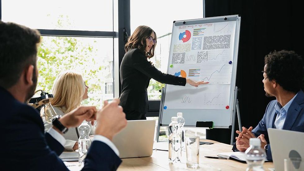 Woman gives a presentation during a business meeting