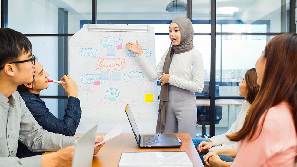 Woman goes out of her comfort zone to present during a meeting