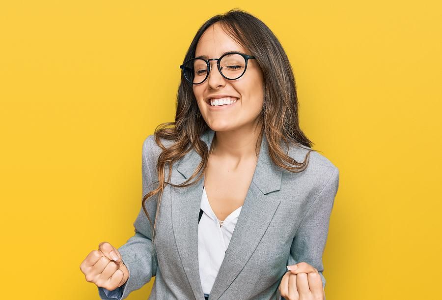 Woman happy after finding a job using the law of attraction