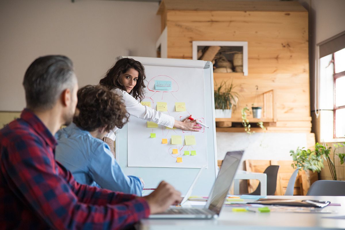 Woman implements root cause analysis procedures at work