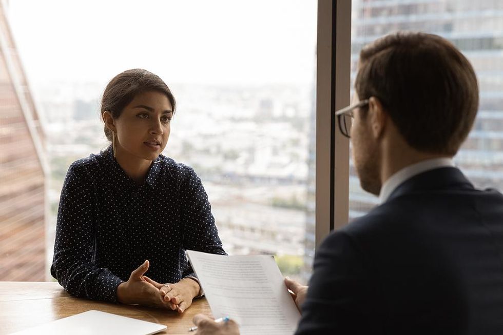 Woman in an interview unsure if the job is right for her