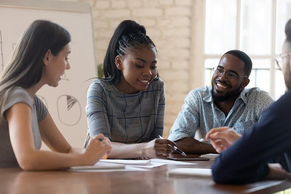 Woman leads her team at work during a meeting