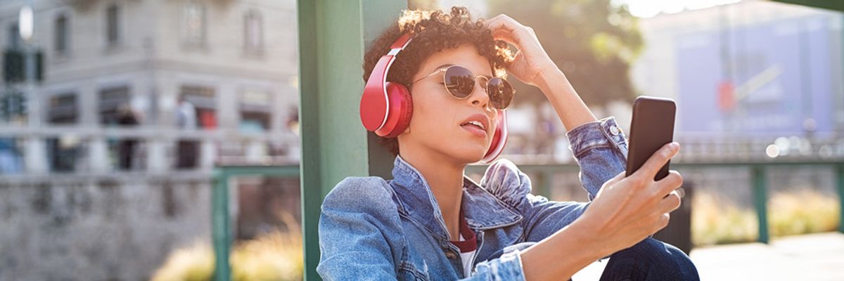 Woman listening to podcast episodes 