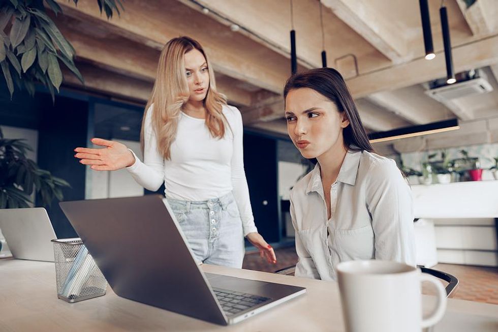 Woman listens to a horrible coworker