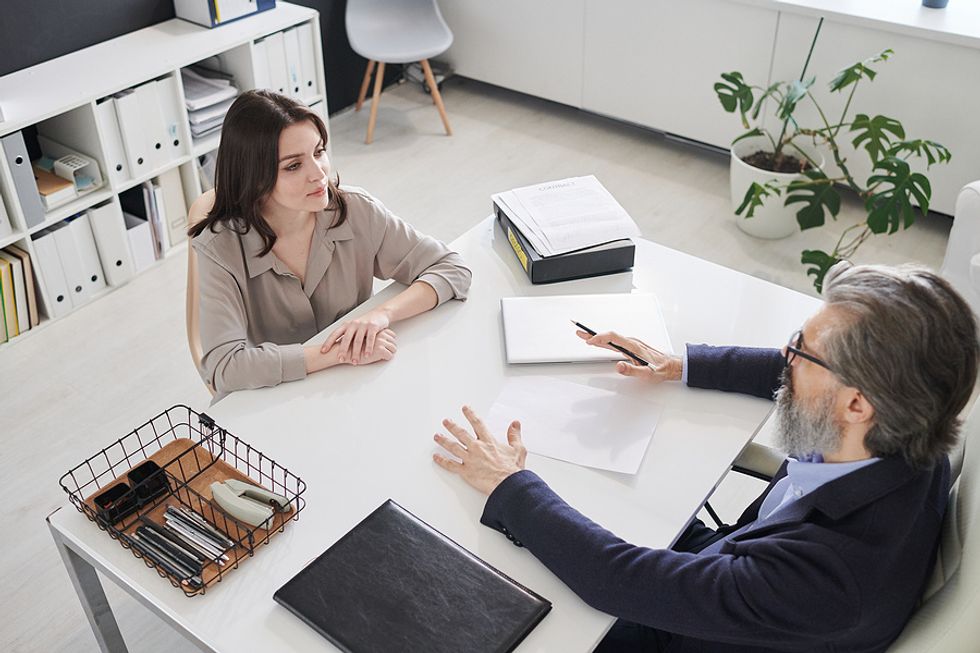 Woman listens to a question during her job interview