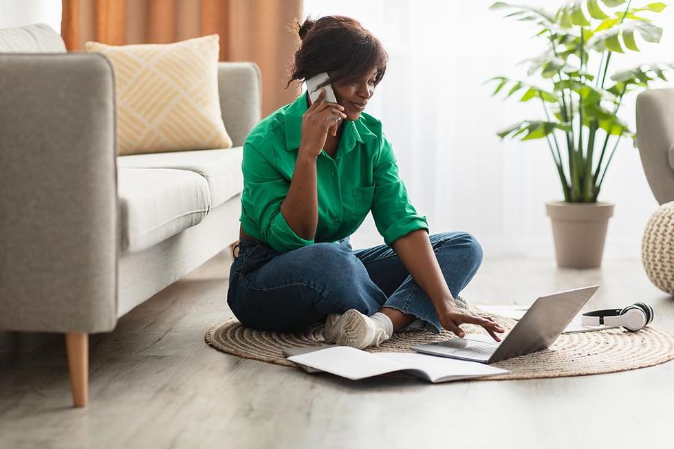 Woman listens to a voicemail for a job