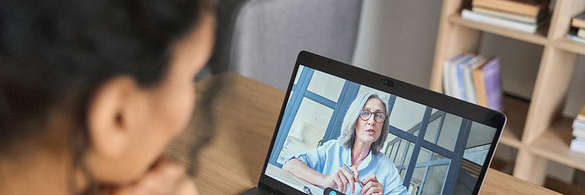 Woman listens to her leadership coach