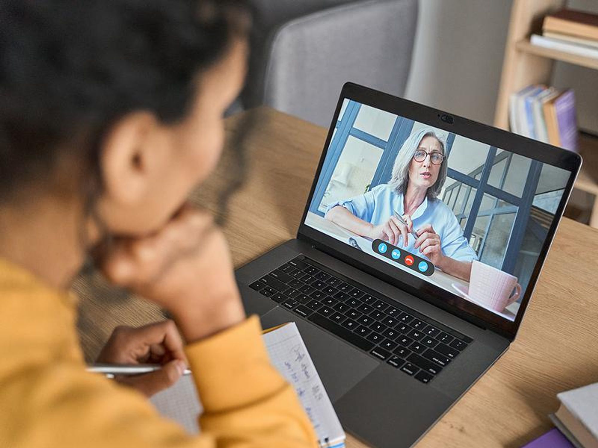 Woman listens to her leadership coach