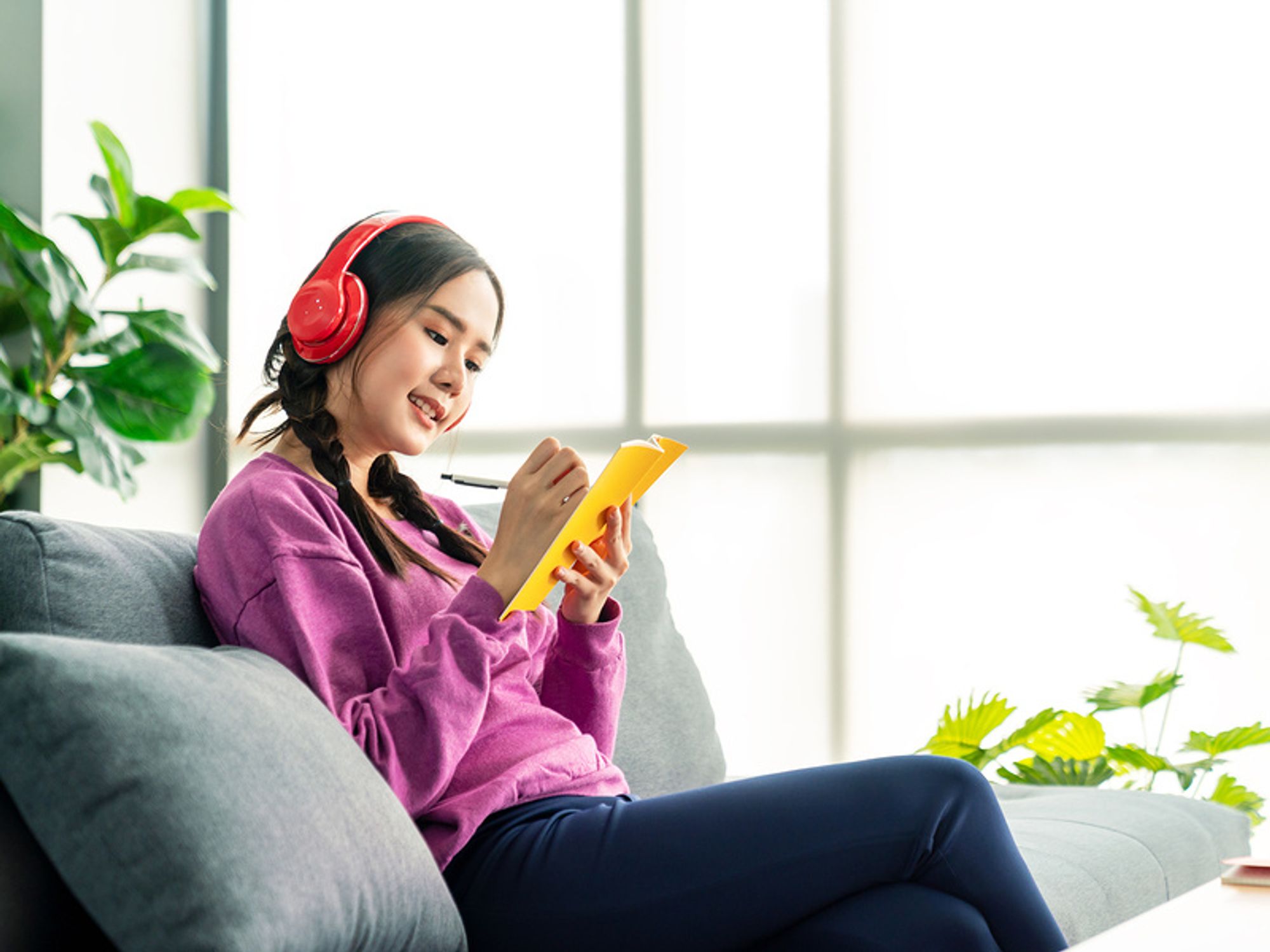 Woman listens to motivational podcast episodes