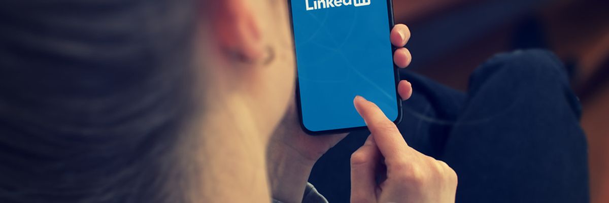Woman logs into LinkedIn to change her headline
