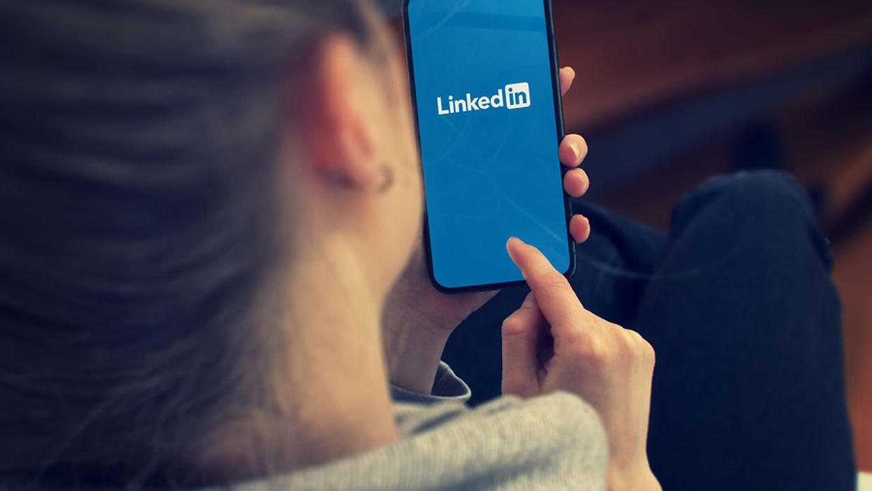 Woman logs into LinkedIn to change her headline