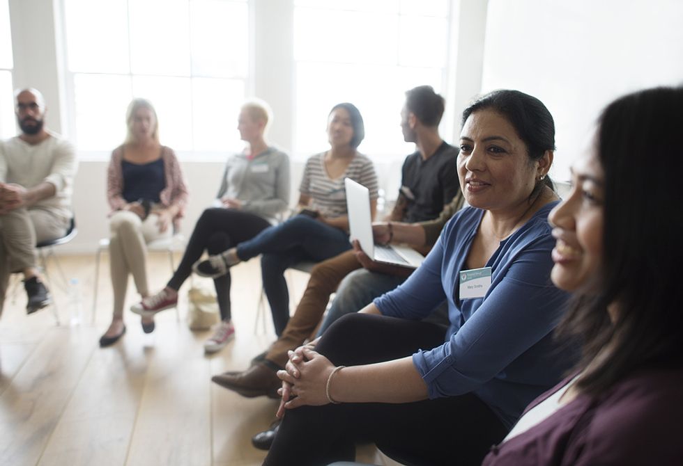 Woman looks to start a conversation at a networking event