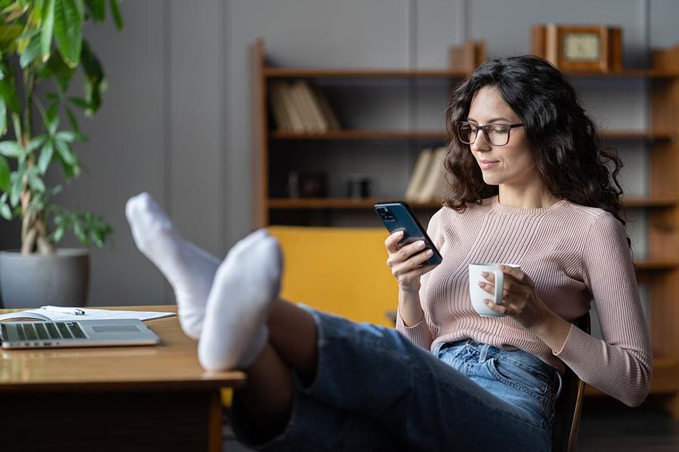 Woman looks up industry trends on her phone