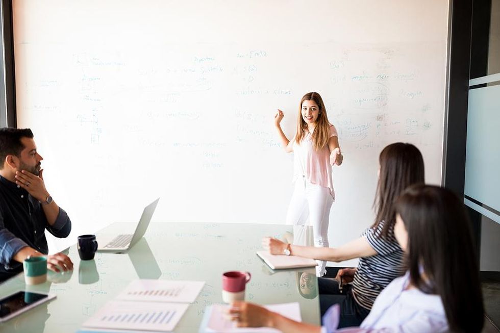 Woman makes sales presentation at work