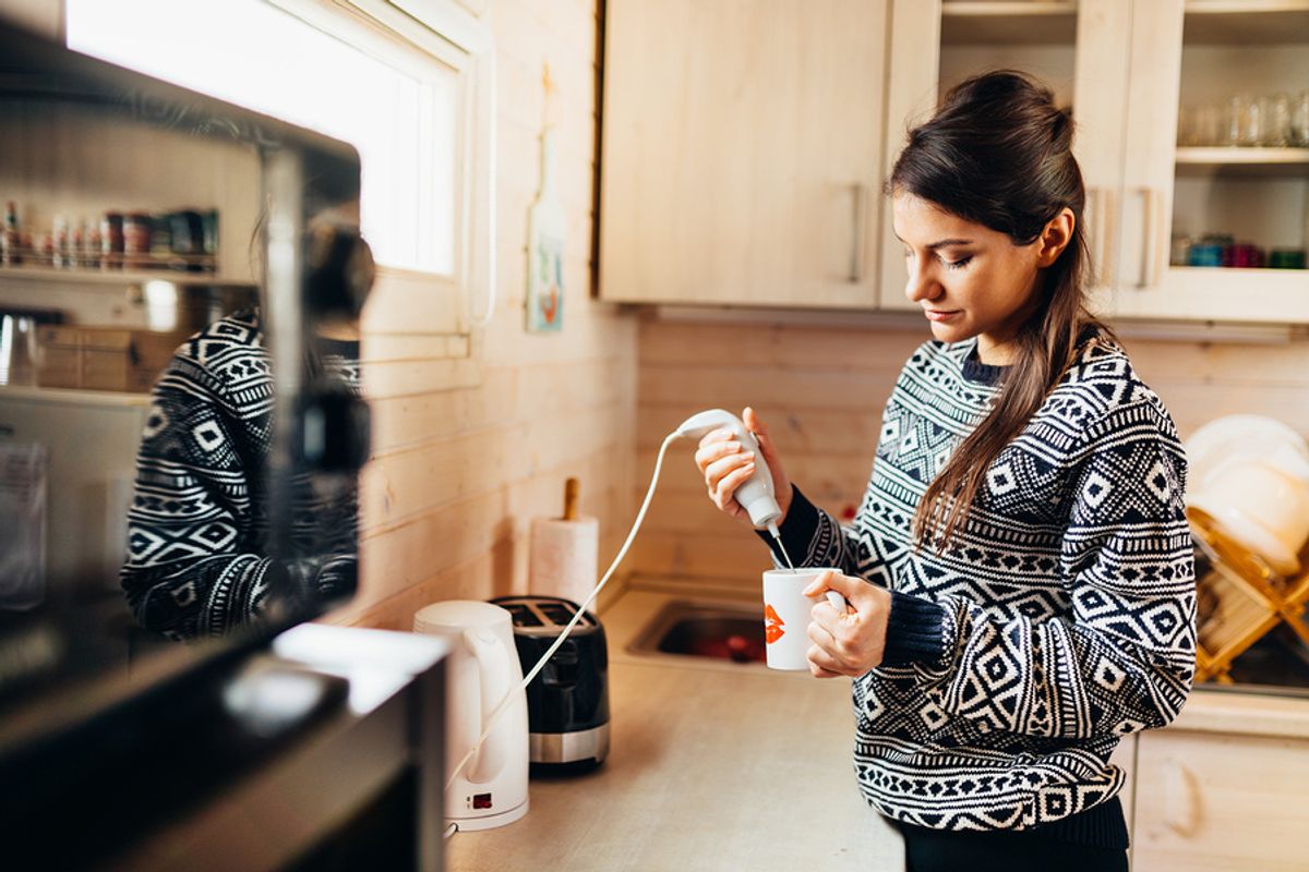 Woman makes whipped coffee before work