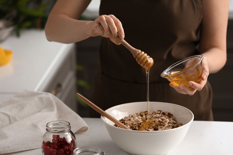 Woman making grain-free granola