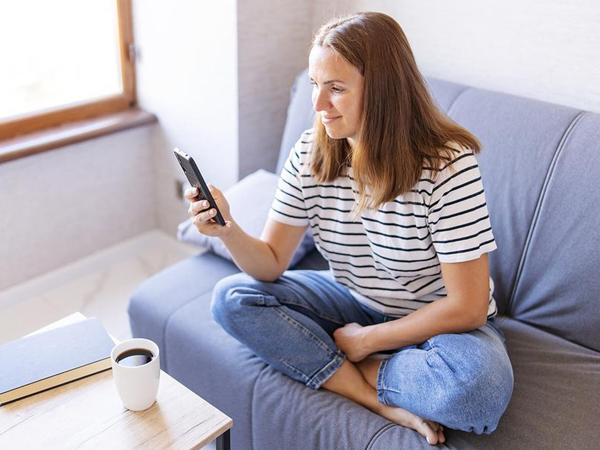 Woman messages a recruiter on her phone