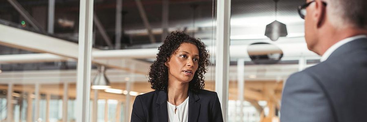 Woman negotiates a better salary at work