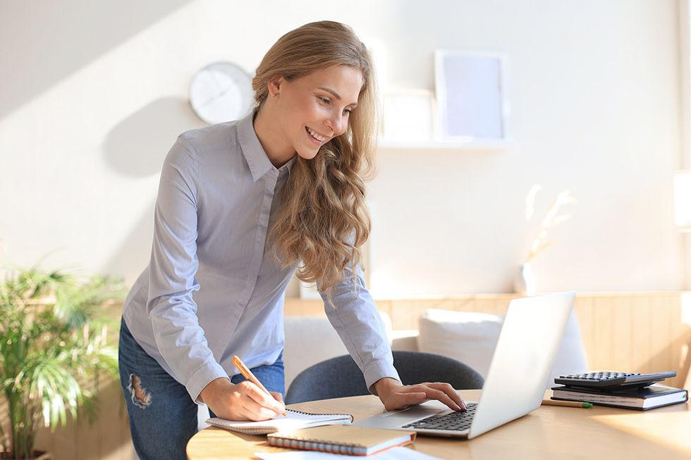 Woman on her laptop uses strategies to speed up her job search