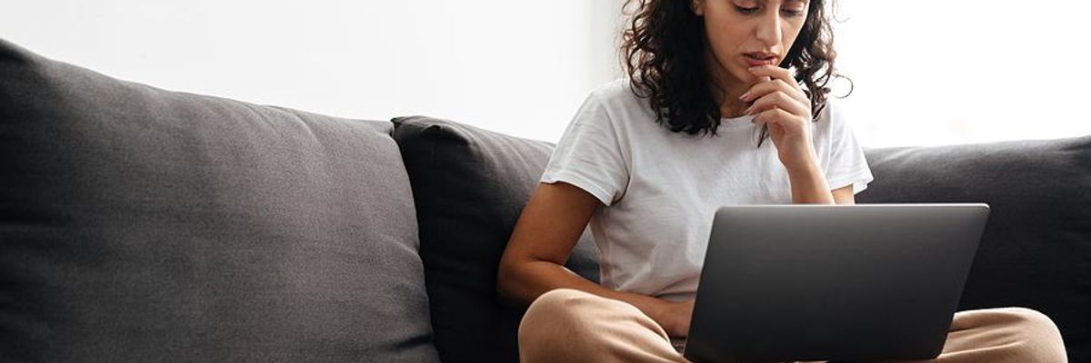 Woman on laptop applies for jobs online