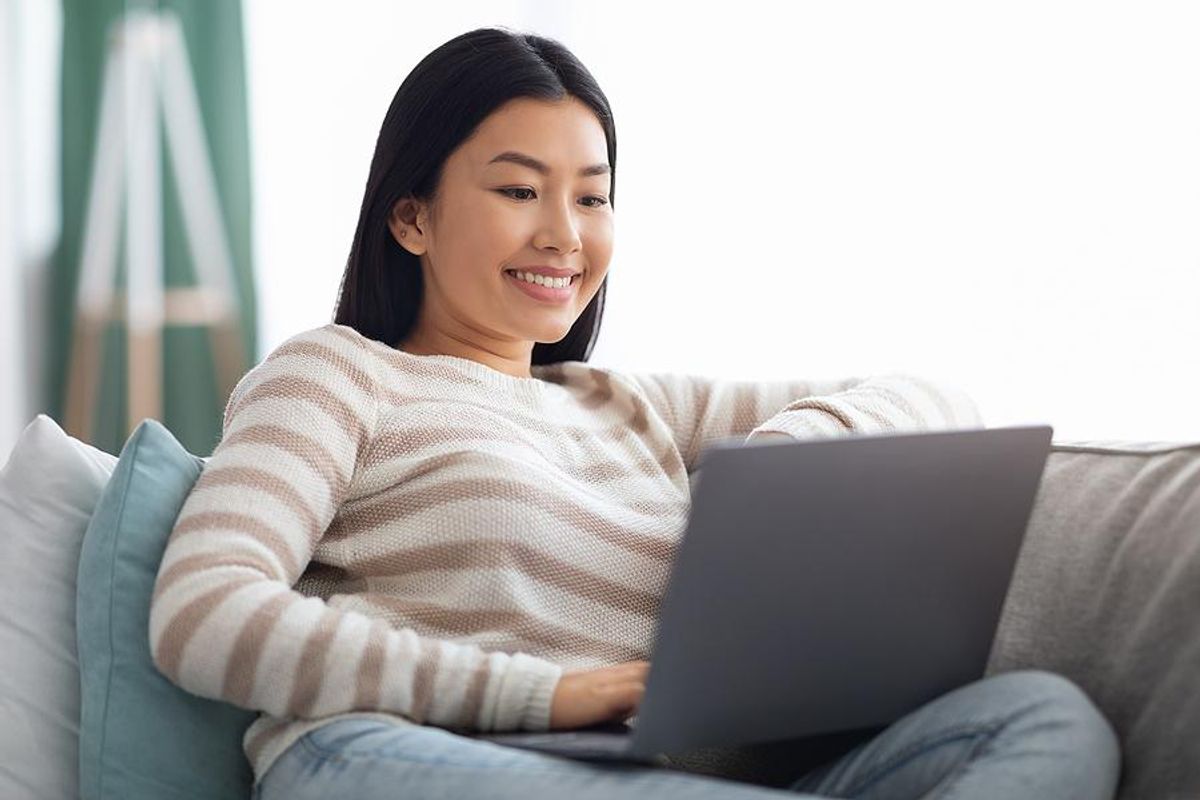 Woman on laptop asks some colleagues for LinkedIn recommendations