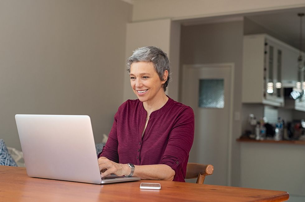 Woman on laptop changes her privacy settings on LinkedIn
