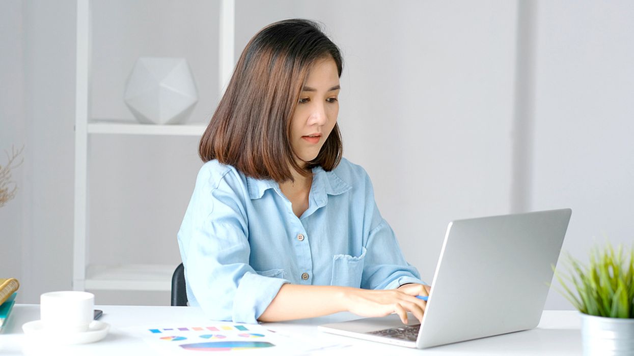 Woman on laptop deletes some information from her LinkedIn profile