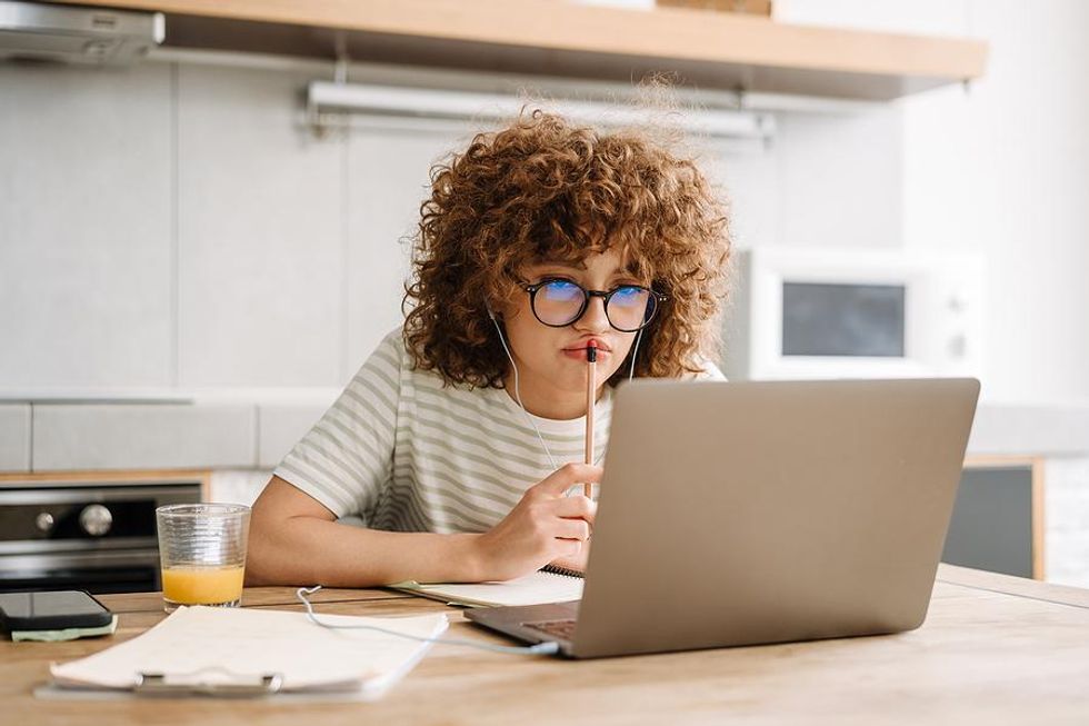 Woman on laptop frustrated and thinks that her resume isn't working