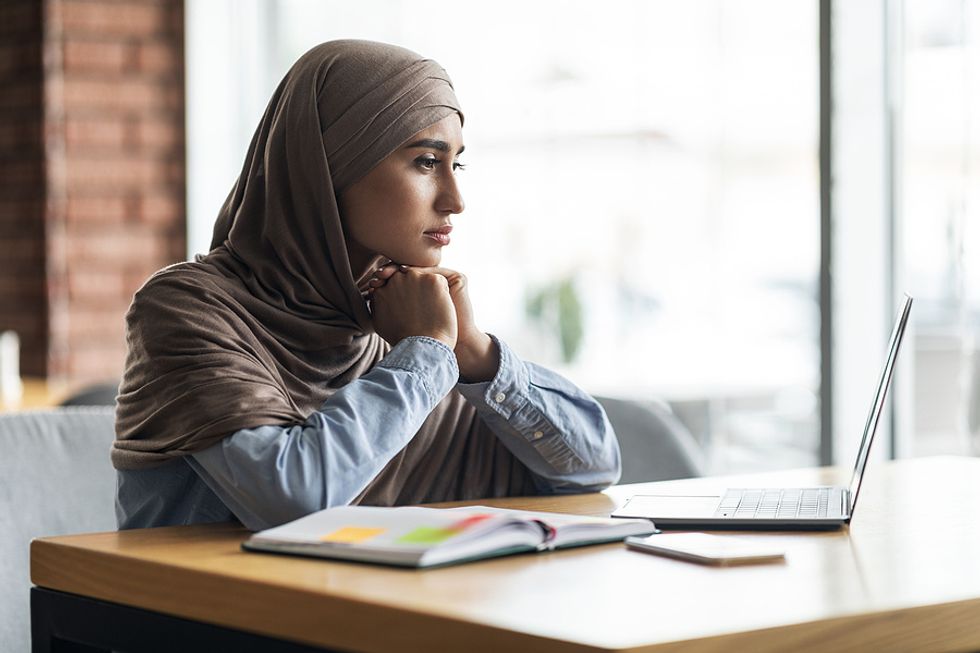 Woman on laptop lacks confidence in her job search