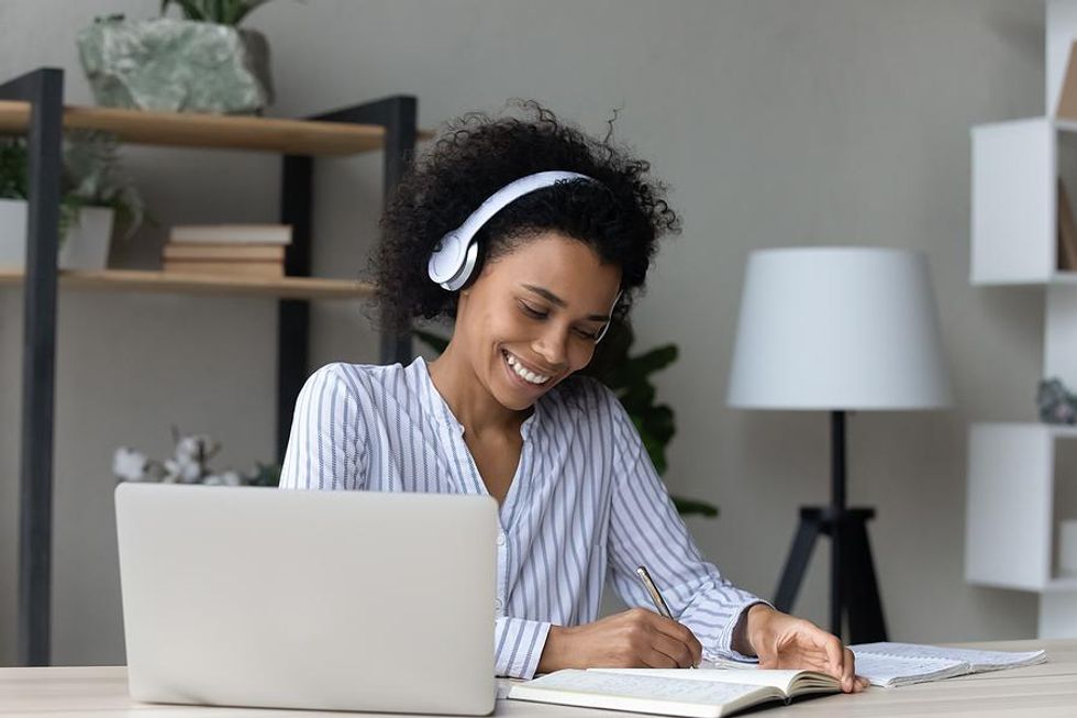 Woman on laptop learns how to get out of a career she hates