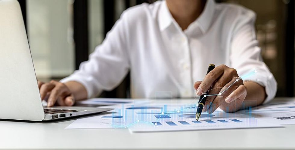 Woman on laptop looking at data