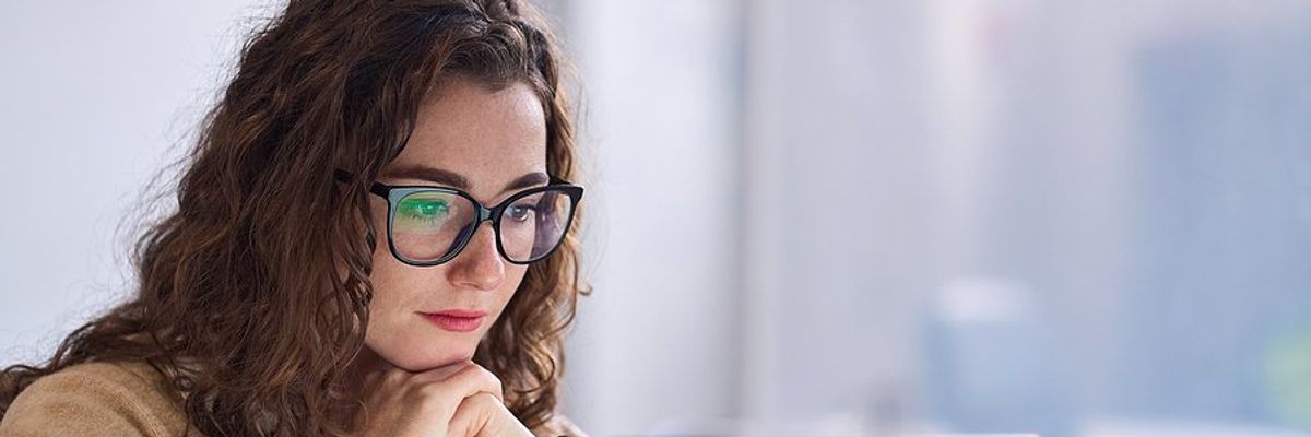 Woman on laptop looking for a job