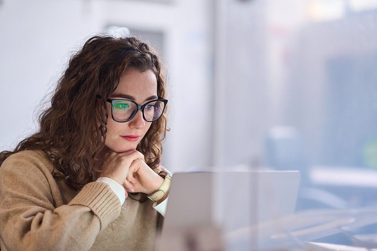 Woman on laptop looking for a job