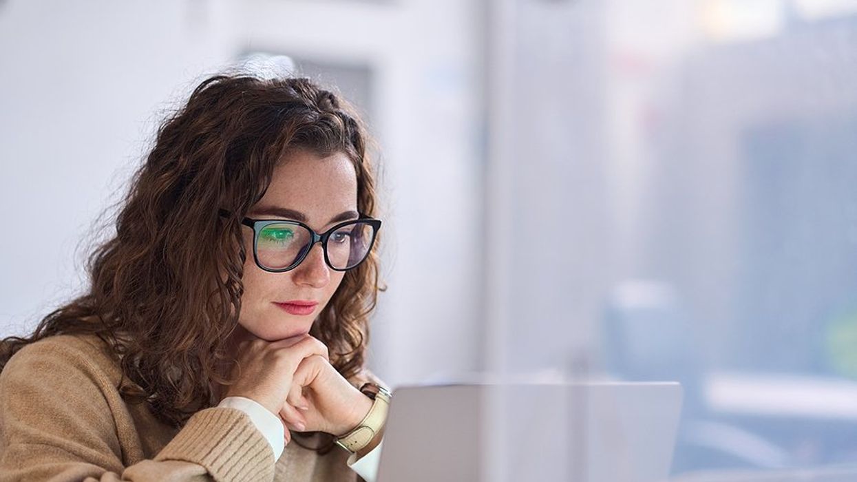 Woman on laptop looking for a job