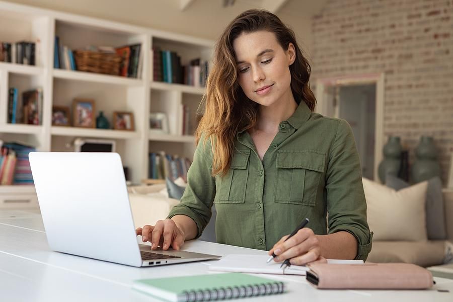 Woman on laptop looks for a job on a Monday