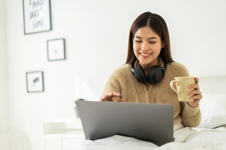 Woman on laptop looks for a job with no experience