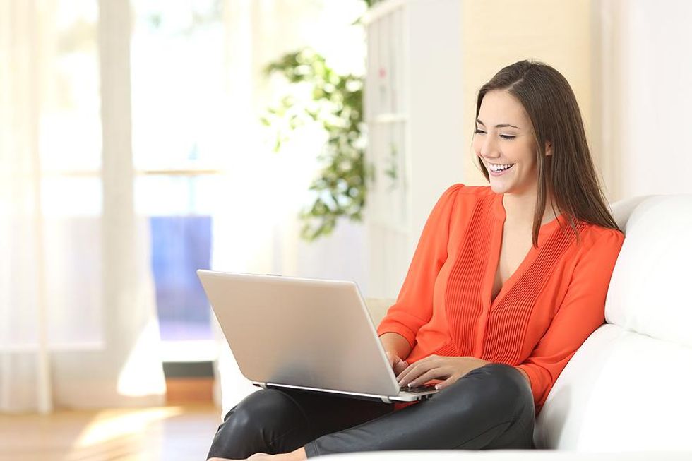 Woman on laptop manages her career