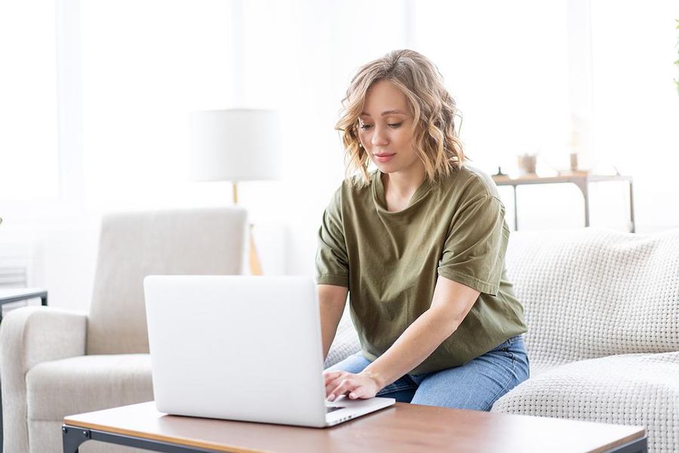 Woman on laptop networks on LinkedIn