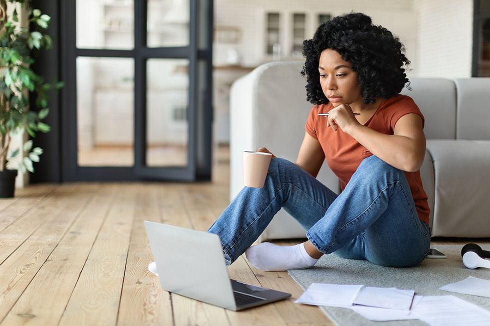 Woman on laptop proofreads her cover letter before sending it to employers