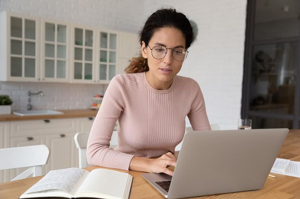 Woman on laptop realizes her resume isn't working