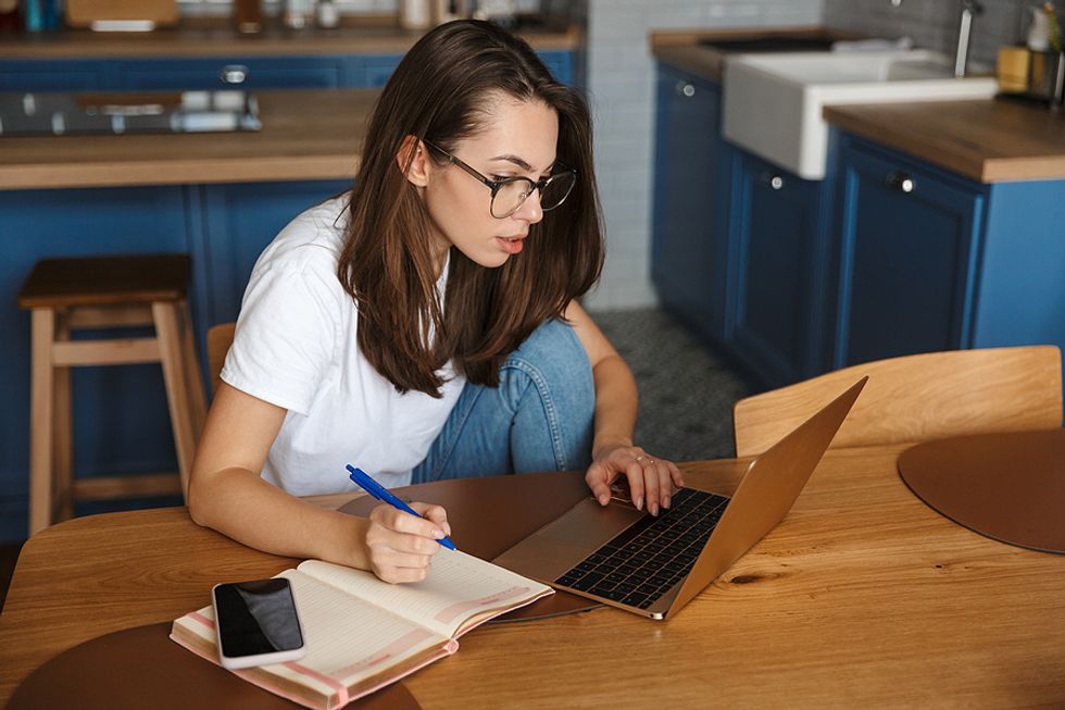 Woman on laptop researches how to connect with an interviewer