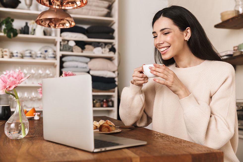 Woman on laptop stays healthy while working from home