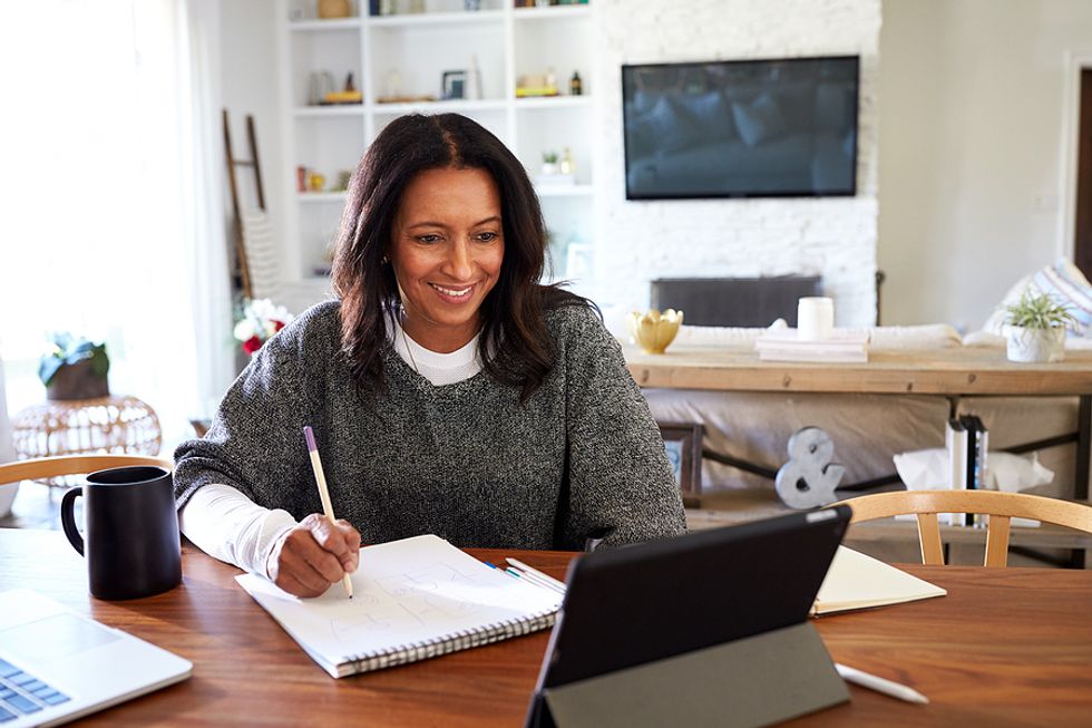 Woman on laptop takes inventory of her skills before returning to the workforce