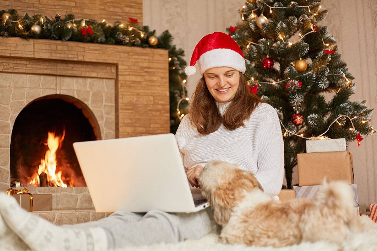 Woman on laptop tries to find a job during the holiday season