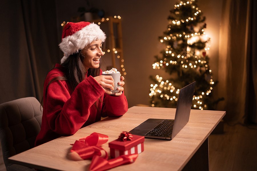 Woman on laptop tries to find a job during the holiday season