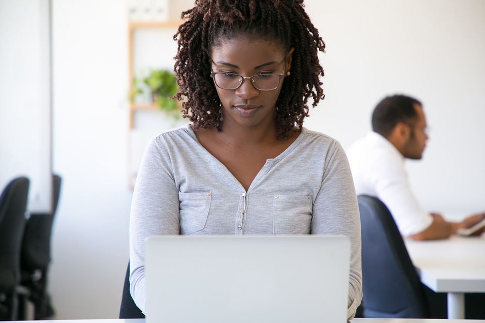 Woman on laptop working in IT