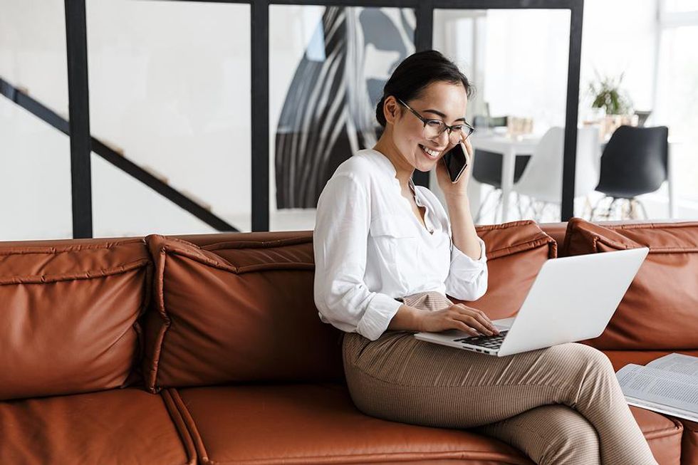 Woman on laptop works a flexible work schedule to balance work and life